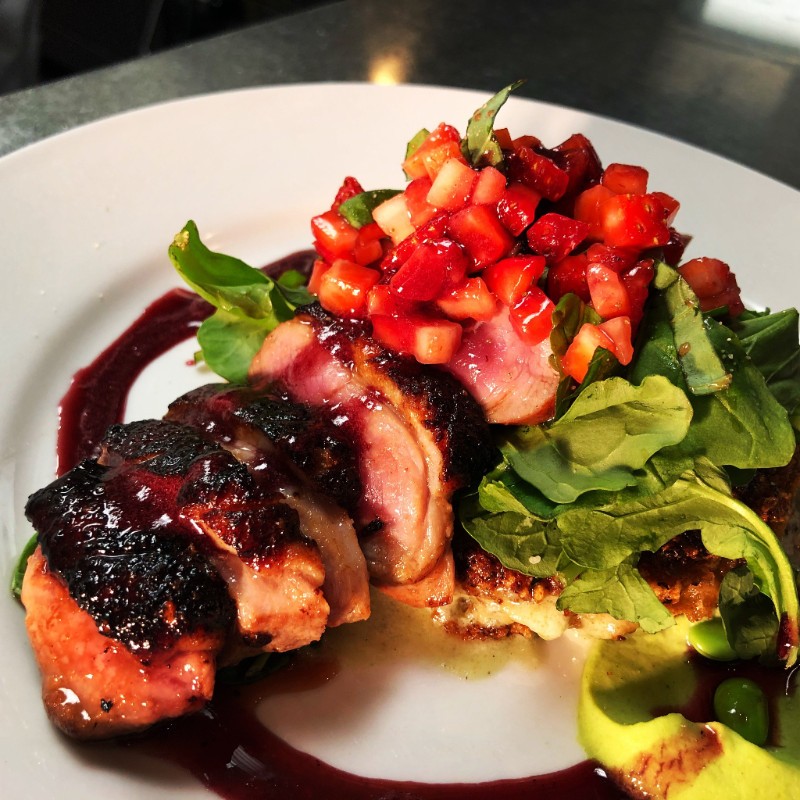 skewered duck with seasonal vegetables and greens