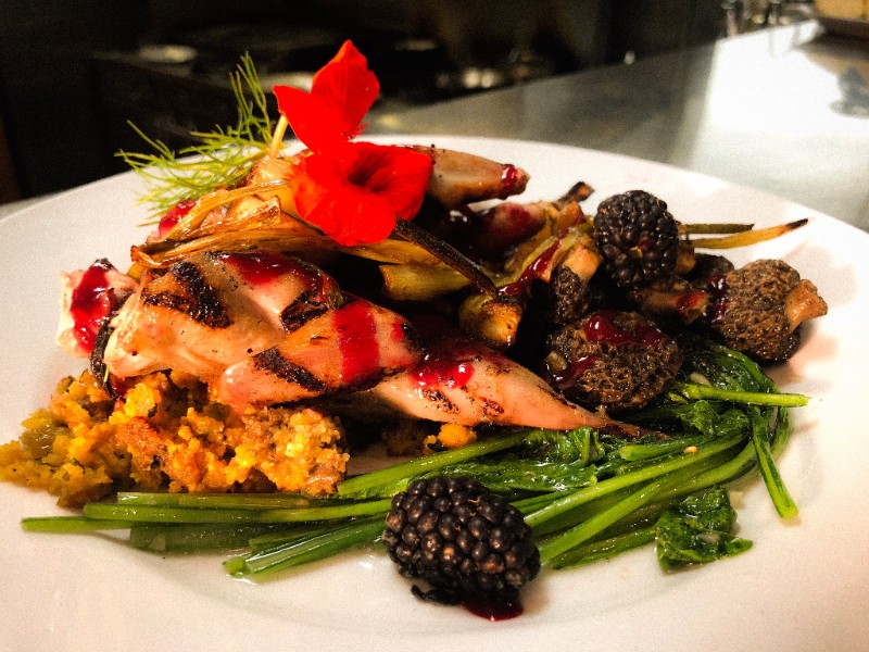 quail over rice with blackberries