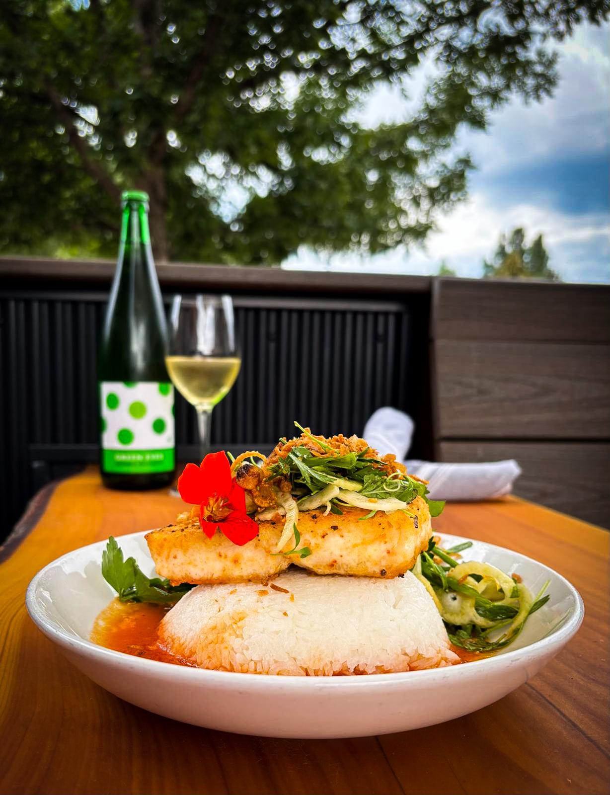Seared black grouper in heirloom tomato broth over jasmine rice